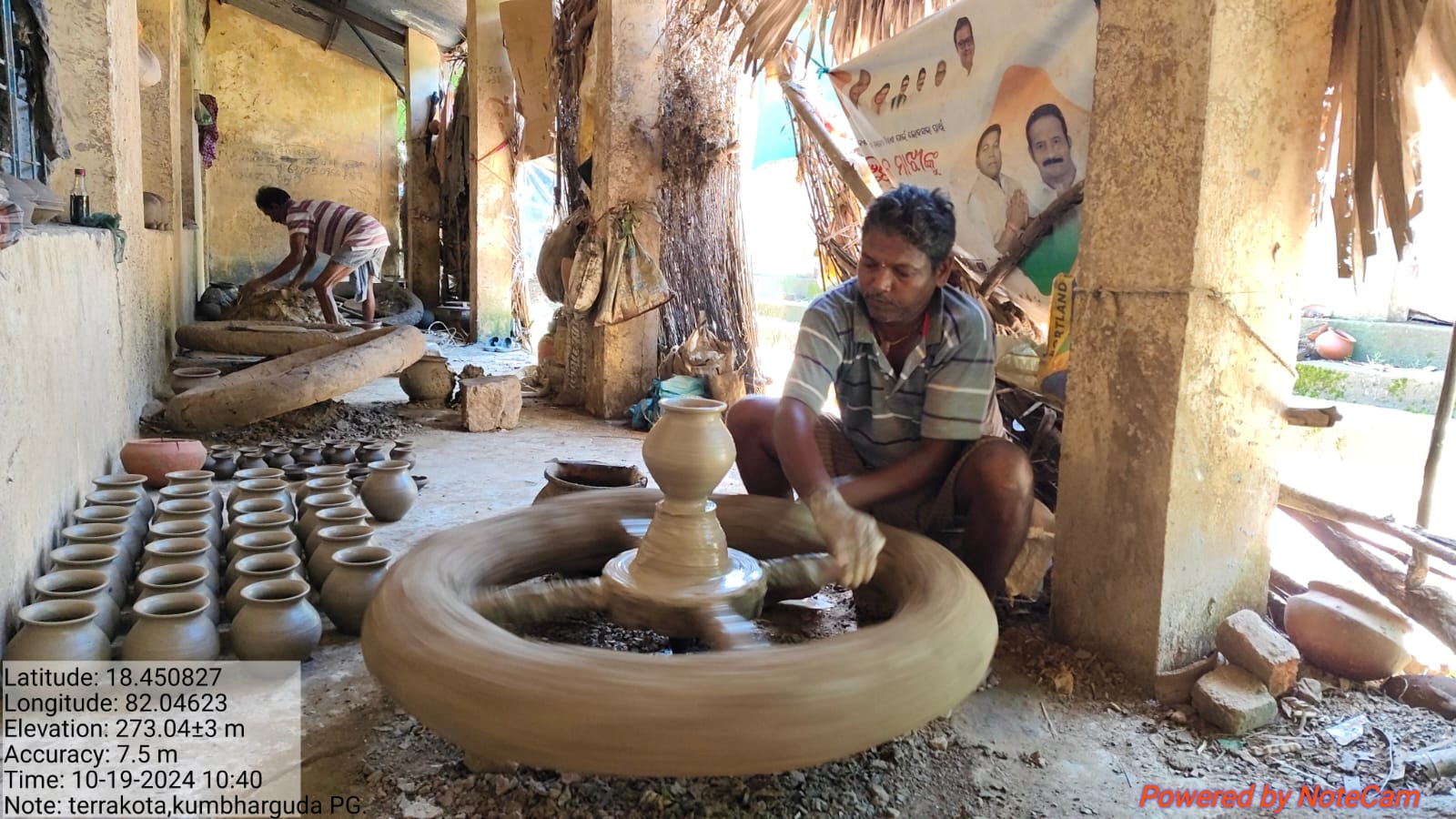 A potter shaping a clay vessel using a traditional wheel